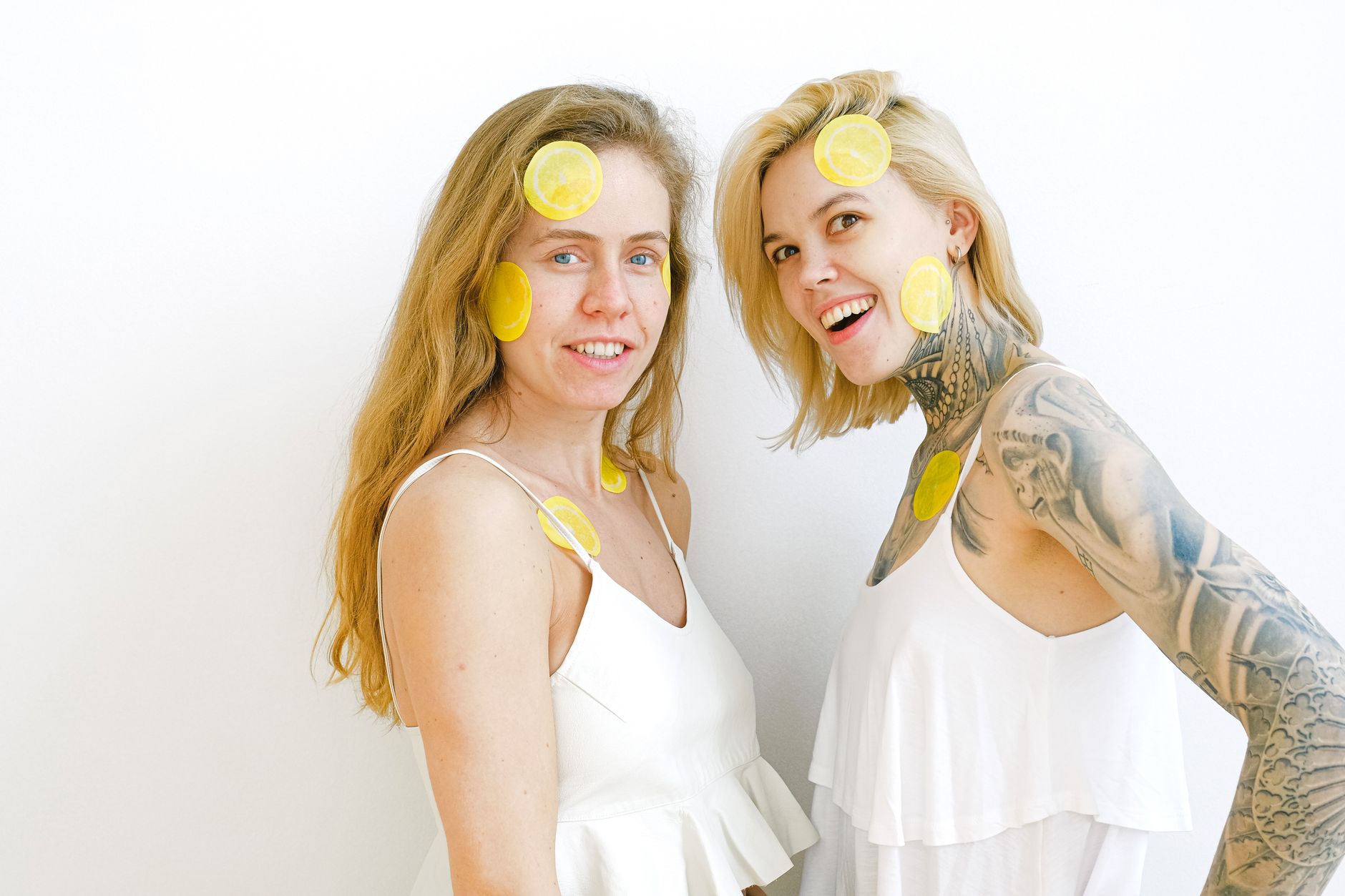Fresh yellow lemons arranged on a pastel background, symbolizing renewal and pleasure